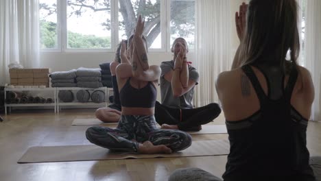 Barefoot-people-practicing-yoga-indoors